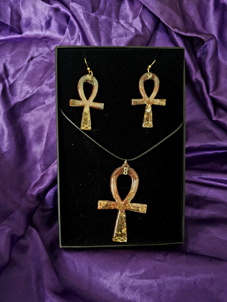 Handpoured Ankh Jewellery set in a black velevt box resting against purpls satin background