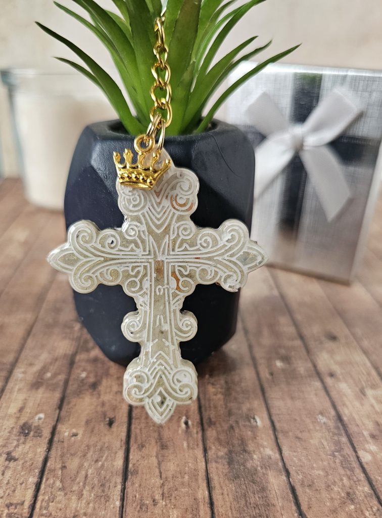 White patterned Cross Resin Keyring with metal crown charm on gold tone keyring.