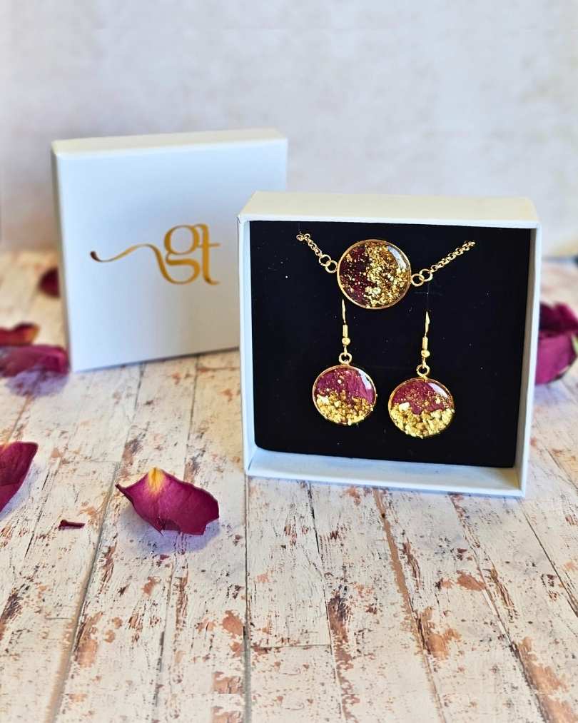 Rose Petal with gold flakes bezel bracelet and earrings in a white logo gift box.